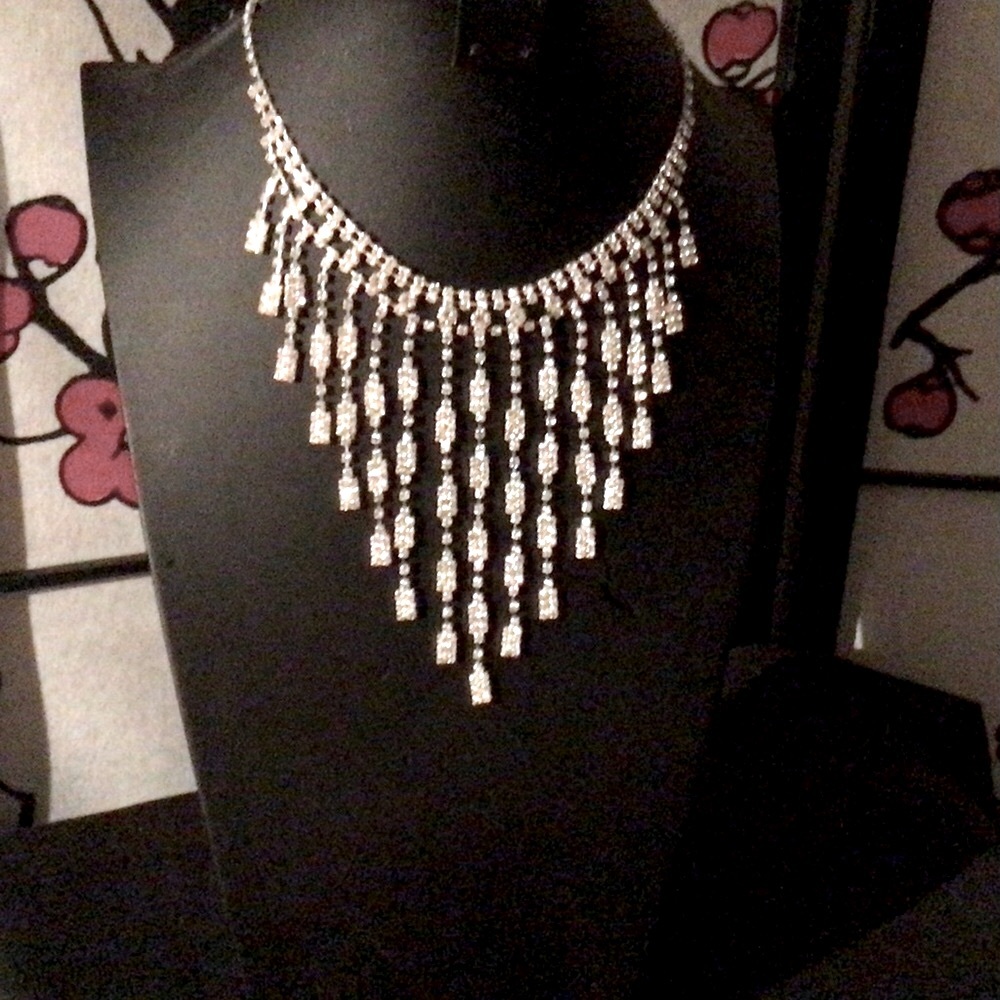 Rhinestone beauty in silver tone with cascading rhinestone rivulets